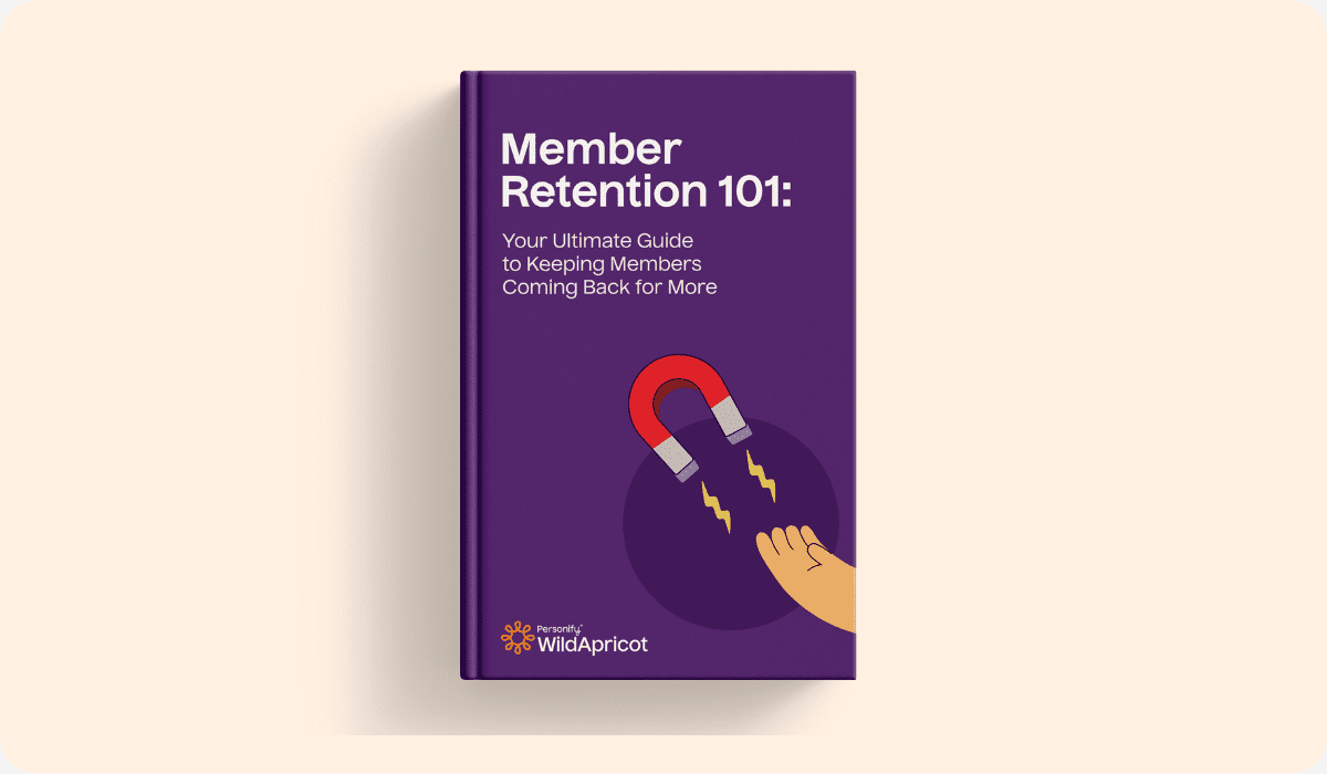Member Retention 101 Ebook: A purple ebook cover with a magnet and hand, symbolizing retention